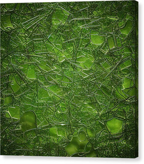 A piece of green glass with some green grass along with some other plants