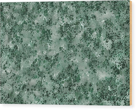 A rug on a counter top that has a green wall printed design on the side.