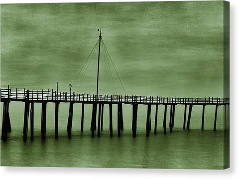A rowboat that is in a green watery pier next to an art print.