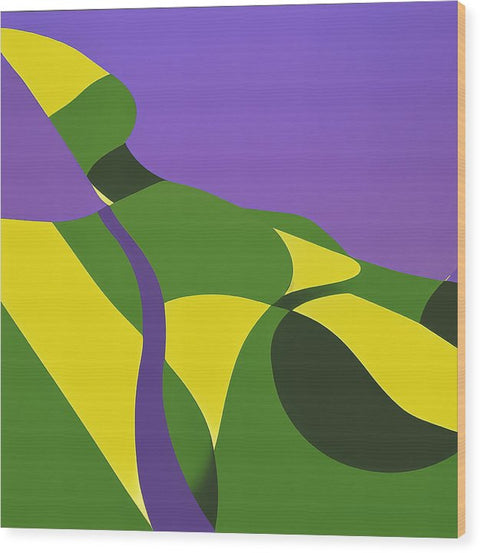 A purple and white painting on a blanket surrounded by green fields and trees.