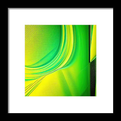 An abstract art image is hanging on the wall with a bright green touch of green