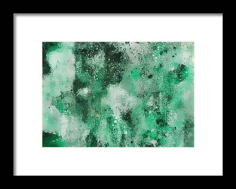 A large green art print of an abstract painting on a white house with trees