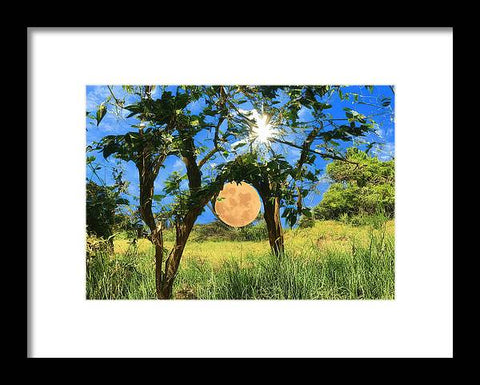 A wooden framed print of a full moon lit up by a bright blue sky