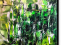 An abstract painting of a green field under a tree in the woods