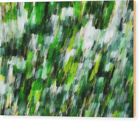 An abstract painting of a green green field sitting on top of a couch.