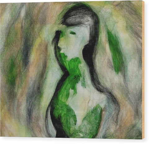 A nude body sitting next to the green draping of a painting