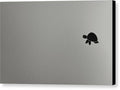 An apple laptop with an origami sticker on the side of it