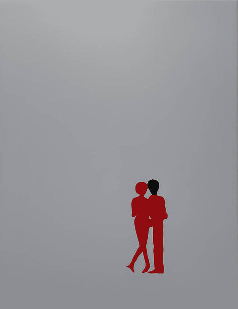 A man and woman are kissing in front of a dark background.