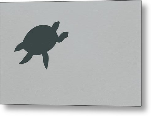 A baby turtle walking along the side of a white tile tile floor with a decal
