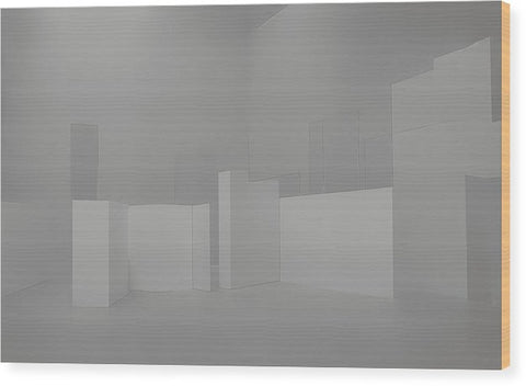 An upright wall covered in stainless steel in a large room.