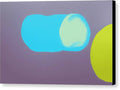 Three colorful spheres hanging from a wall inside of a green painting