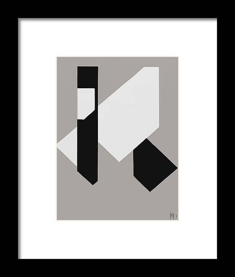 An art print that is designed in geometric style is hanging on the side of wall.