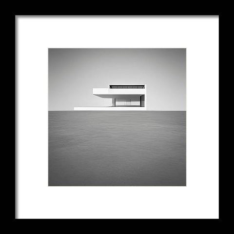 A black and white photo of a white table on a white wall