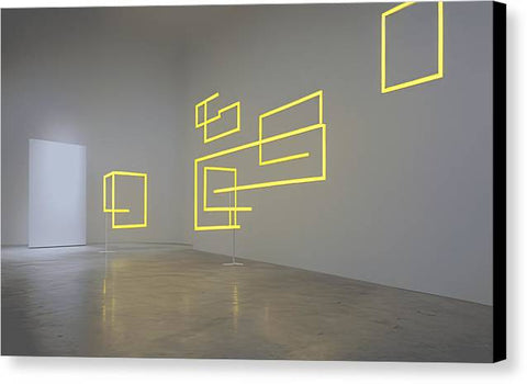 an exhibition that has a very bright yellow tag hanging on the side of a wall