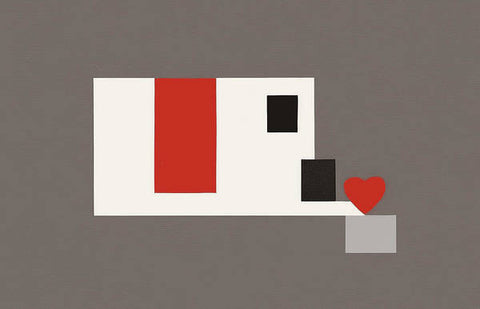 A heart shaped image of game console sitting on a paper paper that says "Love".