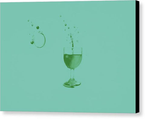 A green wine glass is used to pour something into a white paper and glass