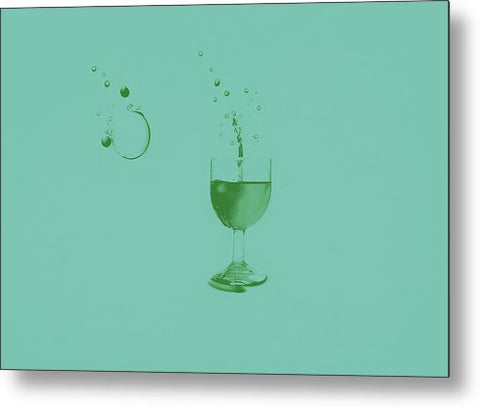 A dark green glass of wine sitting on top of a white plate on white paper.