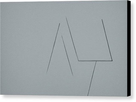 There is a gray tile block below a metal trackpad