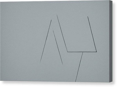 There is a gray tile block below a metal trackpad