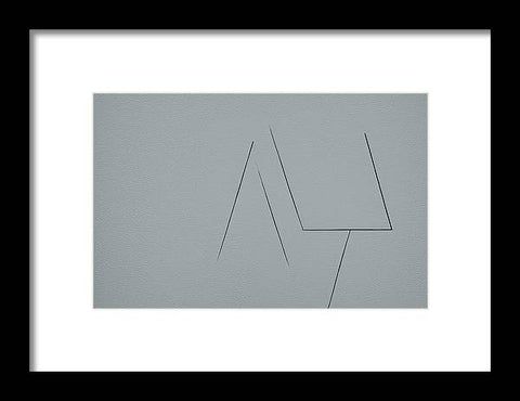 An art print of an arrow pointing at a cross between two triangles.