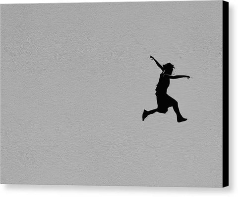 Man jumping off of a skateboard over a ledge in the sky