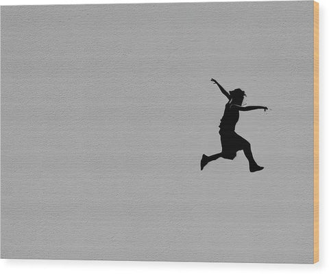 A young girl jumping off of a skateboard into the sky.