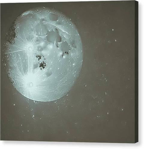 A small moon is seen inside of a picture plate that is painted on a white canvas