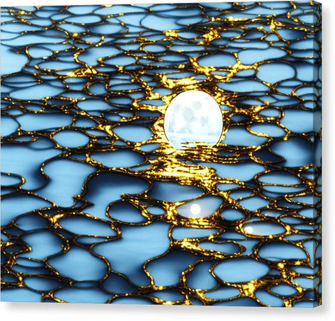 Gold foil and water on a wooden surface on top of a counter.