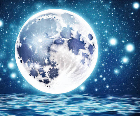 A full moon lights up the night sky in a silver sphere.