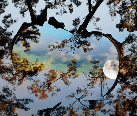 A couple of images of the earth by a reflection in a mirror.