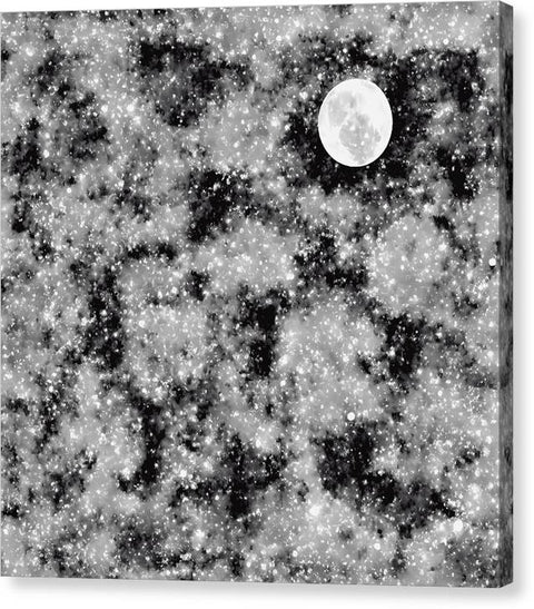 a blanket sitting on a shelf in a black and white image of a moon