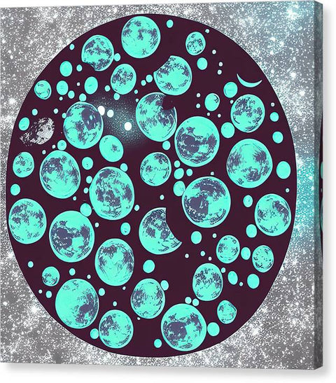 An art print of the moon is on a blue blanket