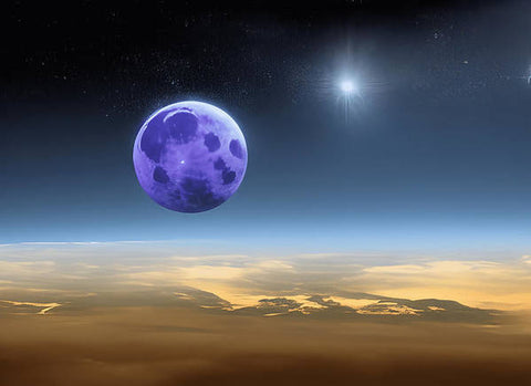 There is an object under a moon covered with a large purple banner on it.