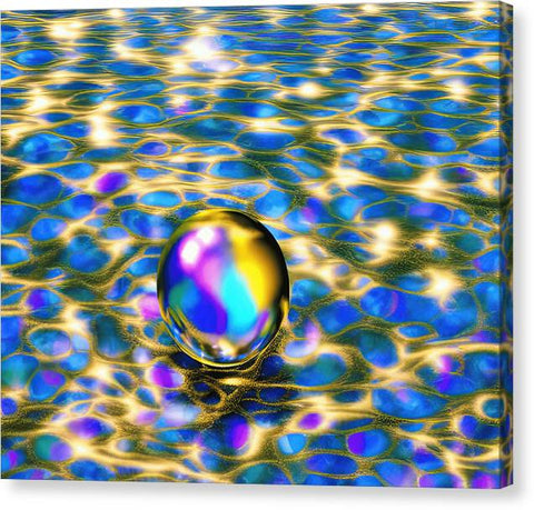 A colorful glass sphere of water floating underwater on blue water