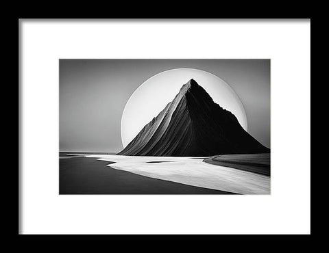 a black and white photo of a mountain with a full moon in the background