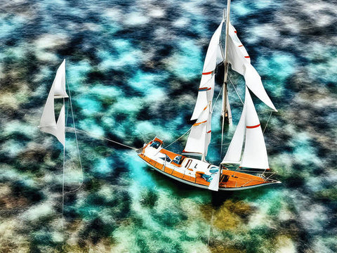 A picture of sails on a sailboat floating in a water surrounded by water