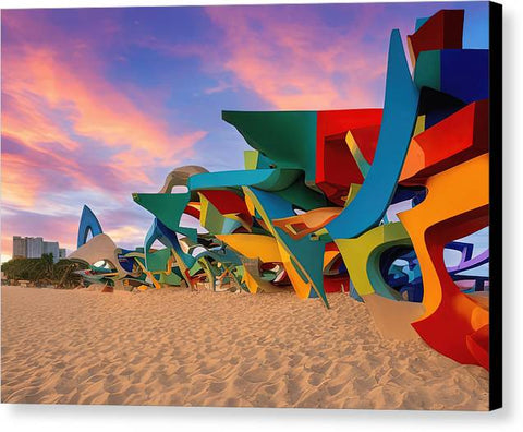 A colorful picture of an interesting wall of art sculptures on a windy beach