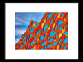A large art print with climbing a mountain in the background