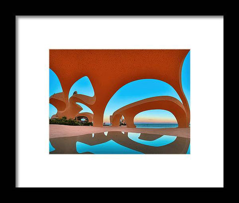 A very colorful art print of an iron archway by the lake behind a black and