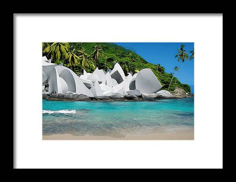 Art prints on a beach and some buildings are standing in a tropical forest