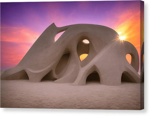 An outdoor structure that is in the middle of a desert sand field