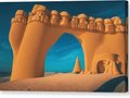 Sand castle is covered in sand under an archway in the sand near a dune