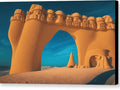 Sand castle is covered in sand under an archway in the sand near a dune