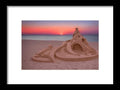 An art print of a sandcastle sitting on the beach