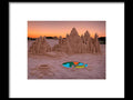 an art print of a sand castle sitting on top of a beach in a desert filled