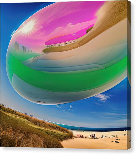 a large colorful sphere sitting on the beach while a mirror sits next to it