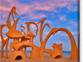 A colorful sculpture of a castle on a sandy beach
