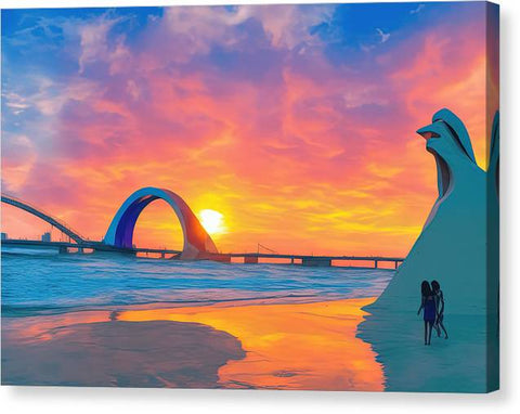 Two surfers are walking along the side of the ocean with an art print in the