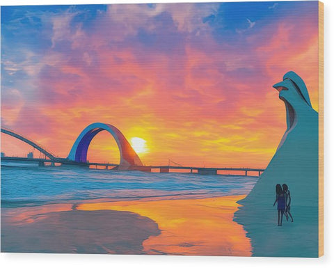 A sunset with a man on a beach and a woman on a surfboard