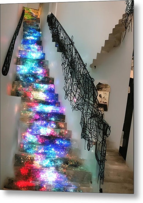 A stair case decorated with decorated Christmas tree decorated with lights